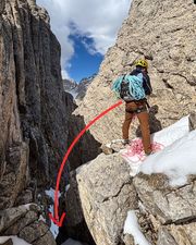 Climber setting up the rappel at the top of the shortcut.
