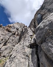 Climber at the bottom of pitch five on Via Rodeo.