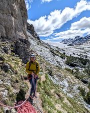 Climber at the base of Via Rodeo on Pilastro Moni.