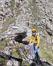 Quad sling anchor over the rock horn at the summit of Pilastro Moni.