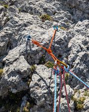 Bolt and piton anchor at the top of pitch one on Via Rododendri.