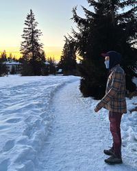 Fiery sunset sky over the forest above Carezza.
