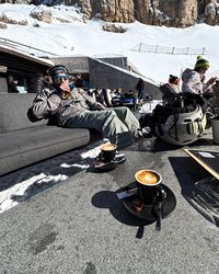 Cozy lounge chairs and low tables outside Laurin Lounge for soaking up the sun between laps.