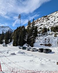 Small snowy parking lot at Moser Alm below the Tschein chairlift at Carezza Ski.