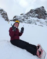 Daysi waving on the Bellunese run with Marmolada’s slopes and peaks behind her.