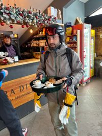 David in a local bar on the mountain in Alpe Cermis, Cavalese carrying coffee and pastry.