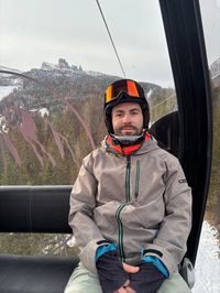 David riding the Cortina Skyline gondola to Cinque Torri