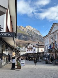 Empty streets of Cortina d'Ampezzo in January with mountain backdrop