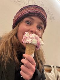 Daysi holding yogurt and raspberry gelato cone from Da Po' in Cortina