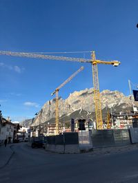 Active Olympic construction site in Cortina with cranes and buildings