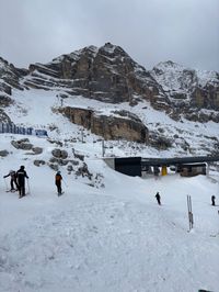 Snow-covered Tofana di Mezzo peak in Cortina visible from higher elevation