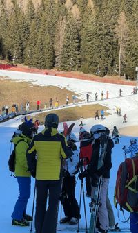 People queuing up for the magic carpet in Latemar, Obereggen.