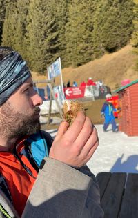 David eating a sandwich at the playground by Baita Gardonè in Latemar, Obereggen.