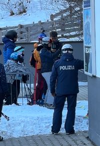 The ski police directing people away from the broken lift in Latemar, Obereggen.