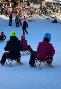 People on the sledding track in Latemar, Obereggen.