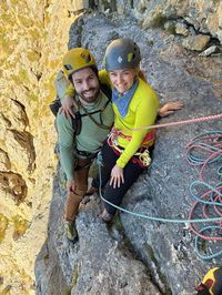 Taking a breather at an early belay ledge on Via Piccola Micheluzzi