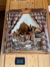 Mountain-inspired mirror art inside Rifugio Roda di Vael in the Dolomites.
