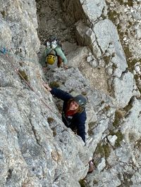 Climbers tackling the awkward start of pitch seven on Via del Gracchio, Roda di Vael.