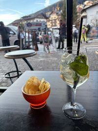Hugo Spritz and snacks at the bar at the bottom station of the Ortisei gondola. It's après-ski time in Val Gardena.