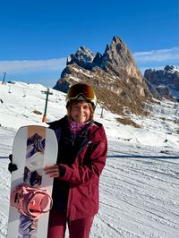 Daysi posing in front of the snowy Seceda peaks in Val Gardena.