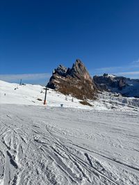 View over the Seceda ski area in Val Gardena, with the Seceda Scenic Ridgeline in the background.