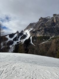 Steep red ski runs and Olympic Pista Schuss slope on Tofana mountain range, Cortina d'Ampezzo, Italian Dolomites