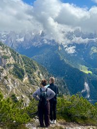 Hikers soaking in Dolomites views on the Tschafon ridge