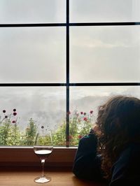 Wine glasses in the cozy dining room of the Tschafon Hut terrace during stormy weather