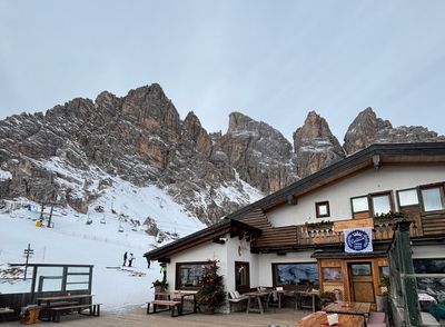 Cortina d'Ampezzo town with Dolomite peaks in winter background