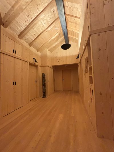 Upstairs common room with charging station at Tschafon Hut