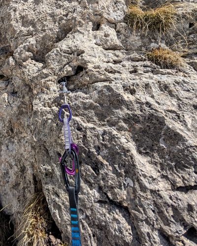 Traditional gear placements in cracks on the first pitch.
