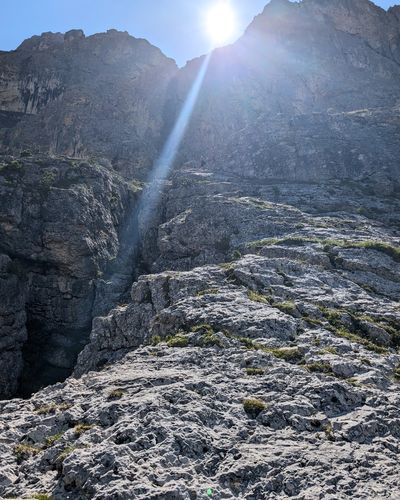 Climber on the mellow slab of pitch two on Via Rododendri.