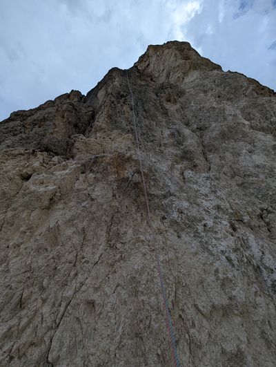 Rappel rope hanging down the back side of Piccola Torre.