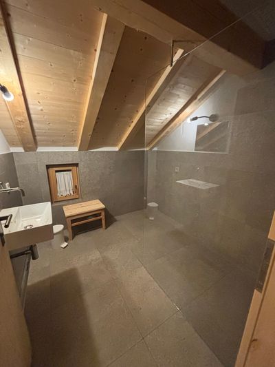 Shared indoor shower at Tschafon Hut.