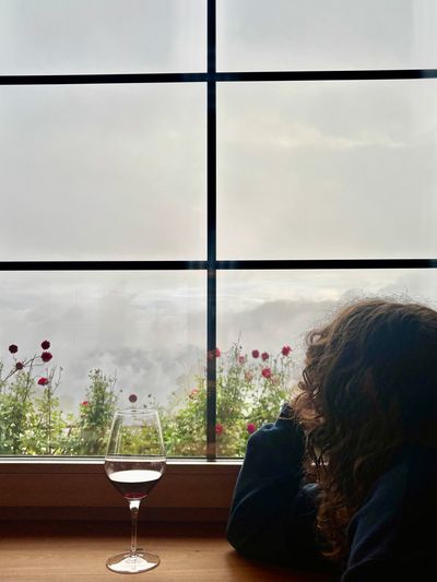 Wine glasses in the cozy Tschafon Hut dining room during stormy weather.