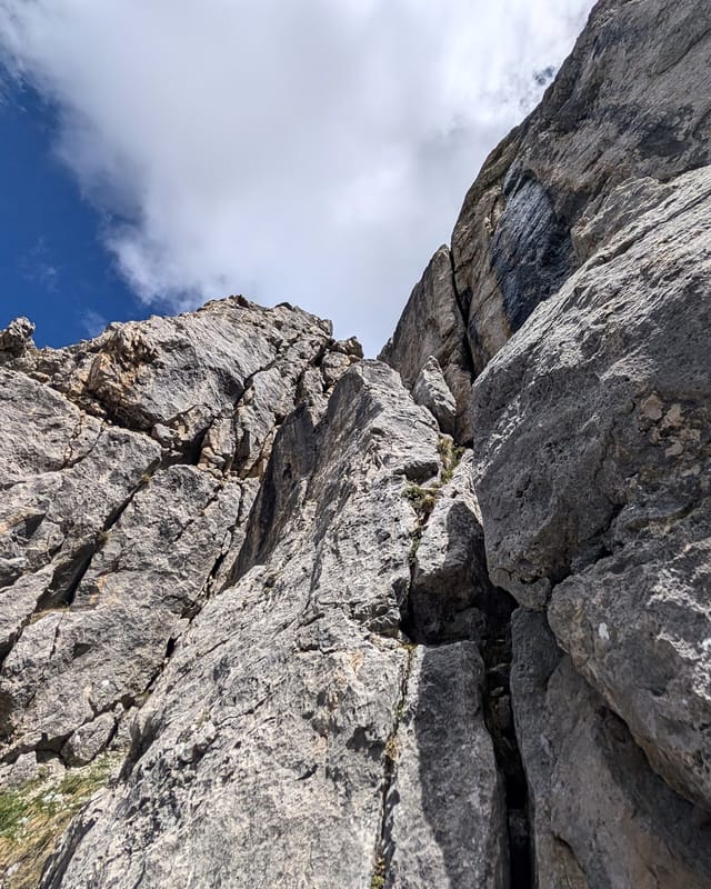 Climber at the bottom of pitch five on Via Rodeo.