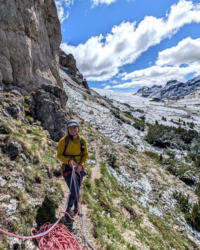 Climber at the base of Via Rodeo on Pilastro Moni.