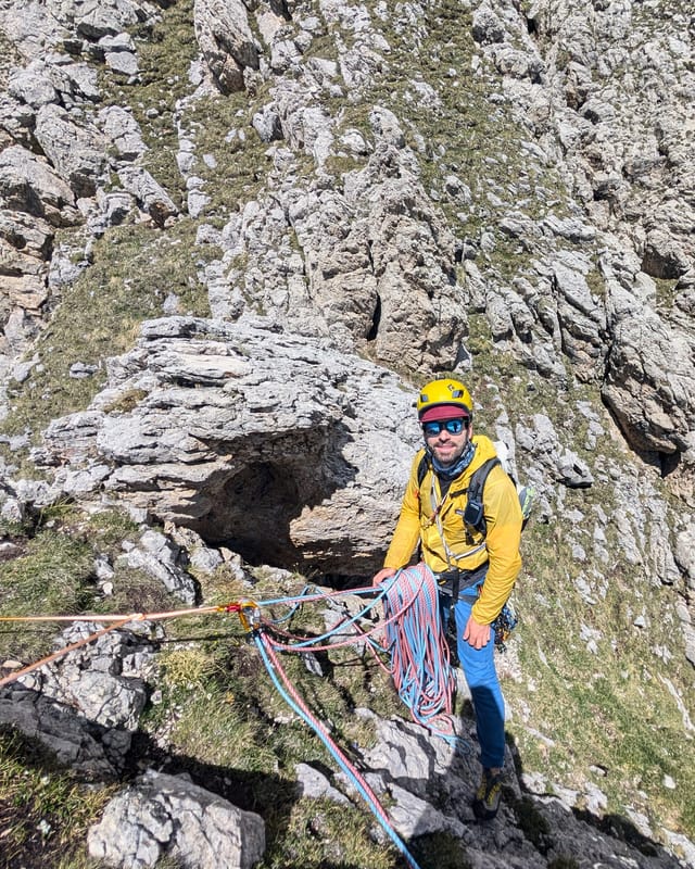 Quad sling anchor over the rock horn at the summit of Pilastro Moni.