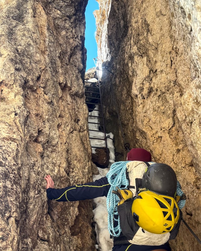 Narrow ladder passage on the via ferrata approach to Torre Finestra.