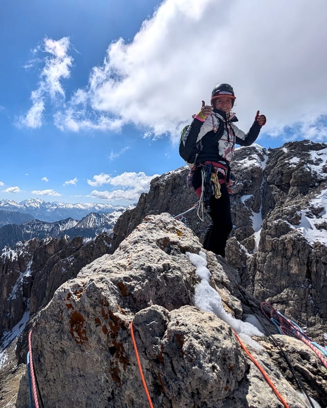 Climber standing on the summit of Torre Finestra.