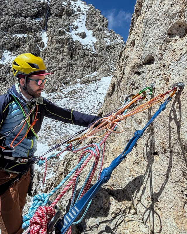 Modern bolted anchor at the first belay station.