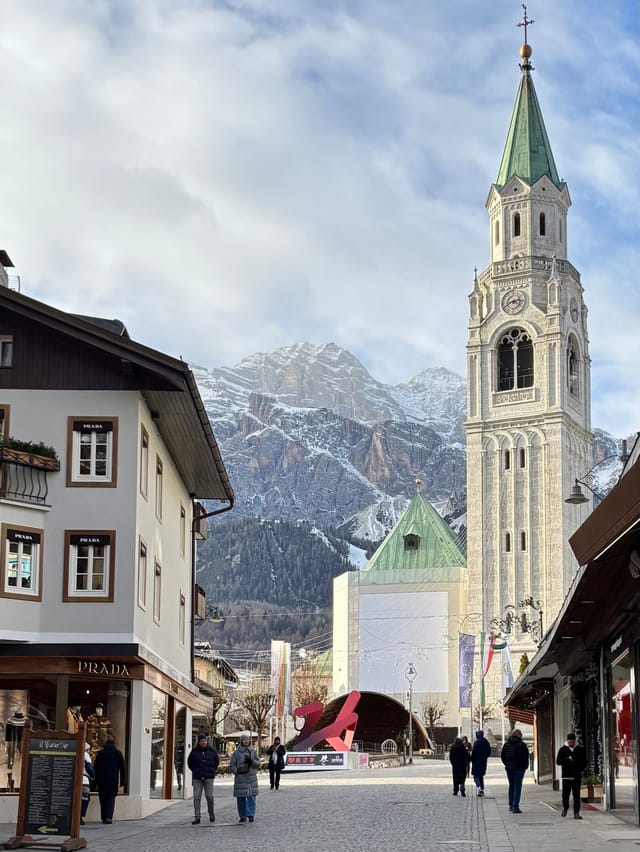 Bell tower in Cortina d'Ampezzo with Tofana in the background.