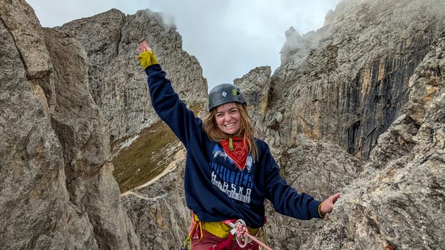 Daysi at the top of Via del Gracchio on Torre Edwards above Rifugio Roda di Vael