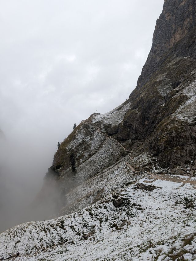 Snow-covered descent trail from Rifugio Bergamo